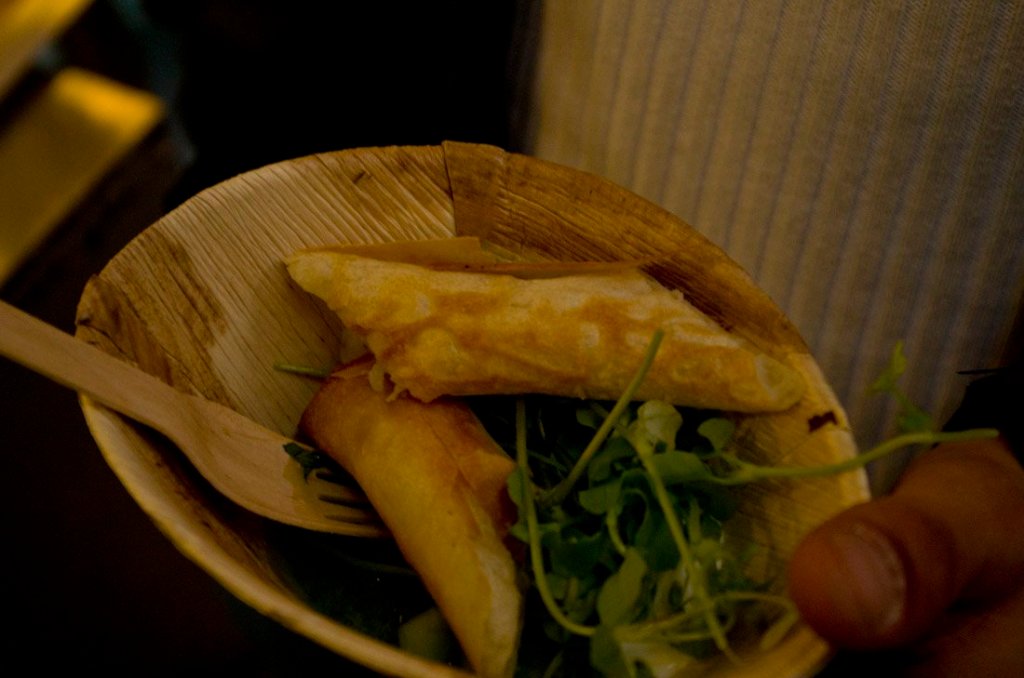 a close up of a sandwich and a bowl of food