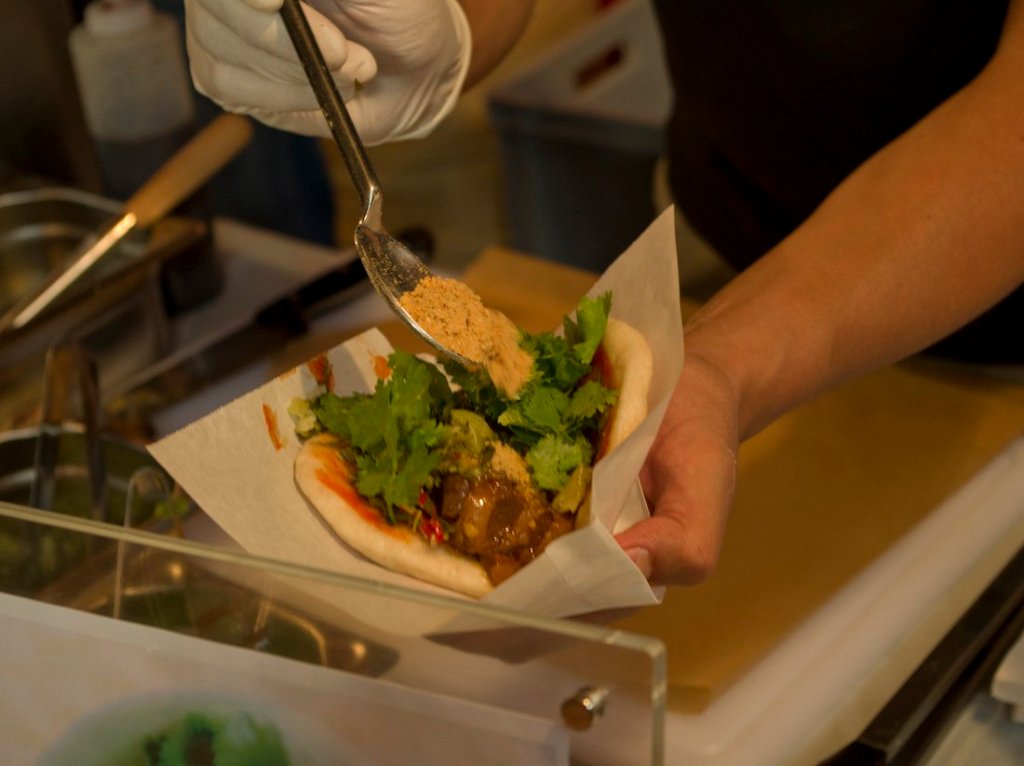 a person cutting food on a table