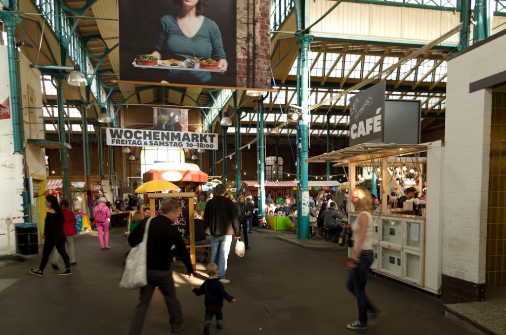 a group of people walking down a street