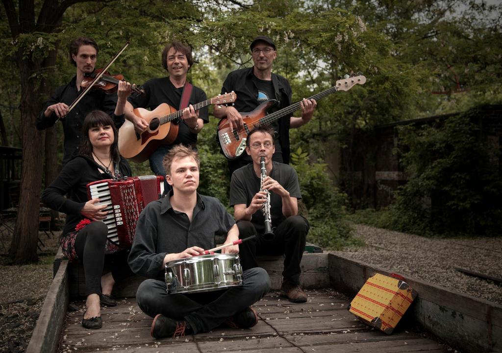 a group of people around each other