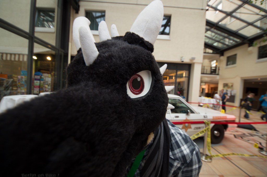 a close up of a stuffed animal in front of a building