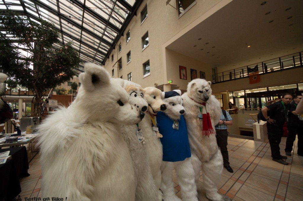 a group of stuffed animals on display in front of a building