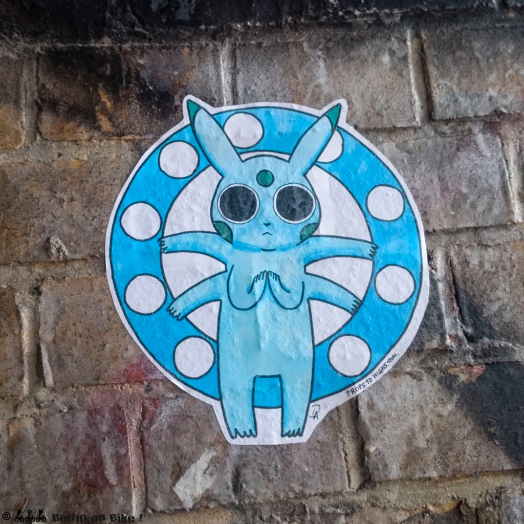 a stone building that has graffiti on the side of a brick wall