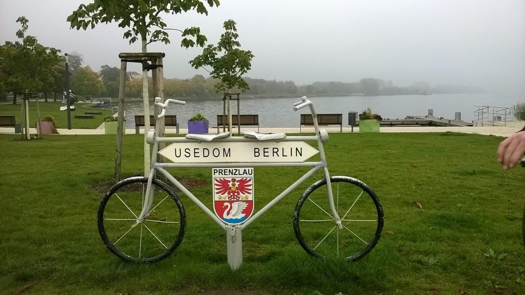 a bicycle parked on the grass