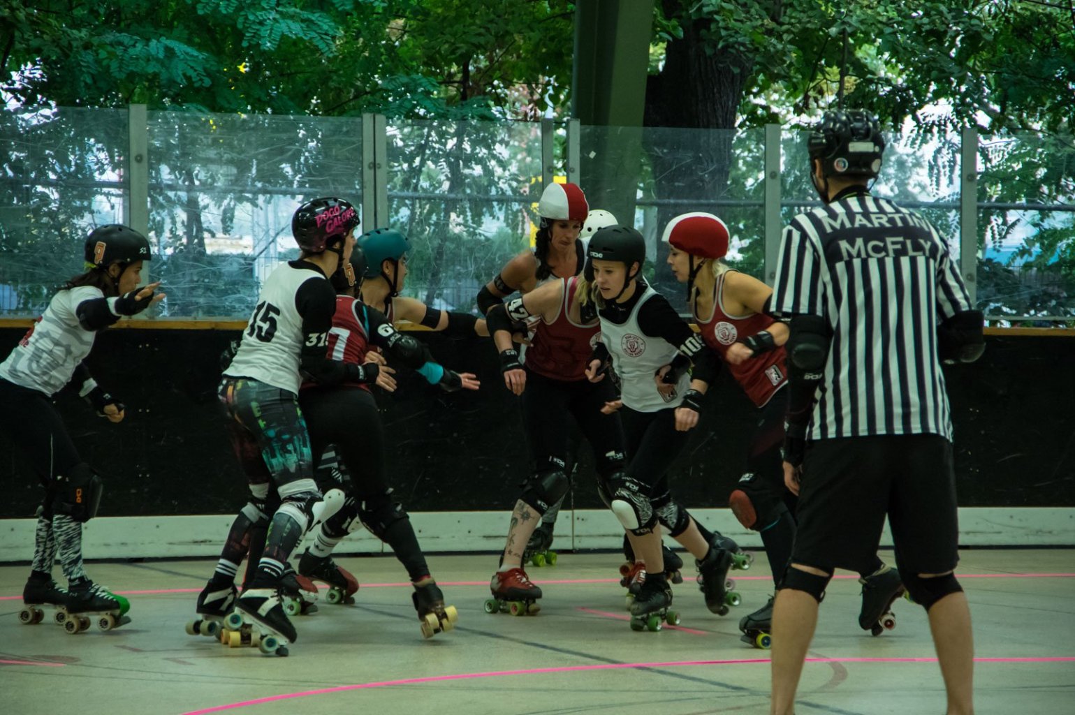 a group of people riding on a skateboard