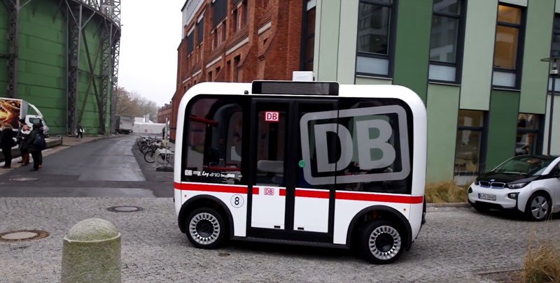 self-driving-car-berlin-olli-local-motors a bus that is parked on the side of a road