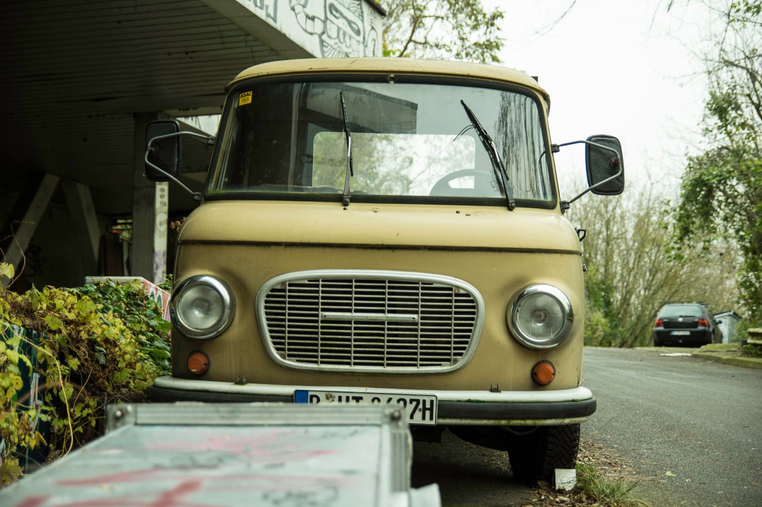 a truck is parked in front of a car