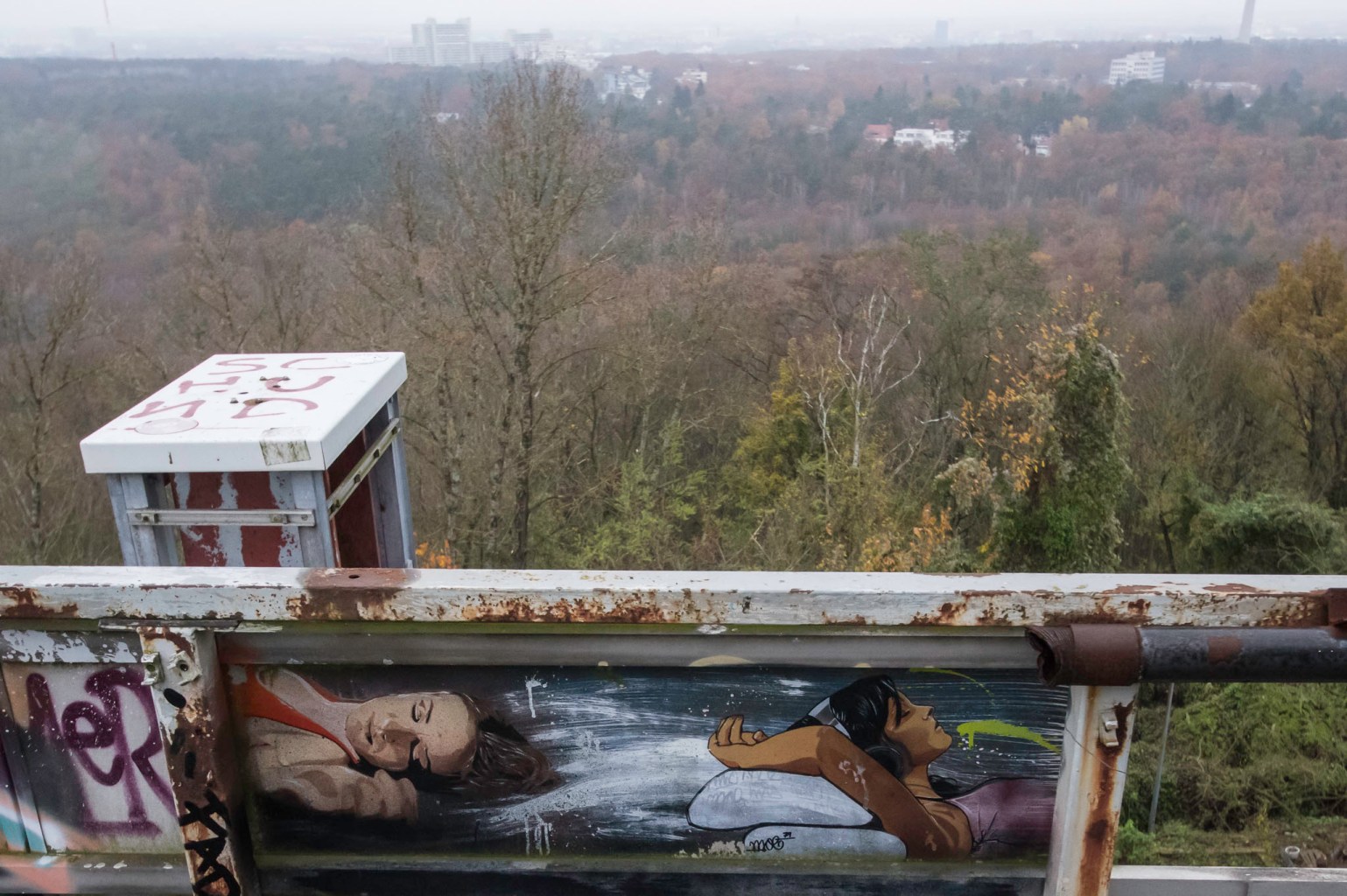 a person sitting on a bench with a mountain in the background