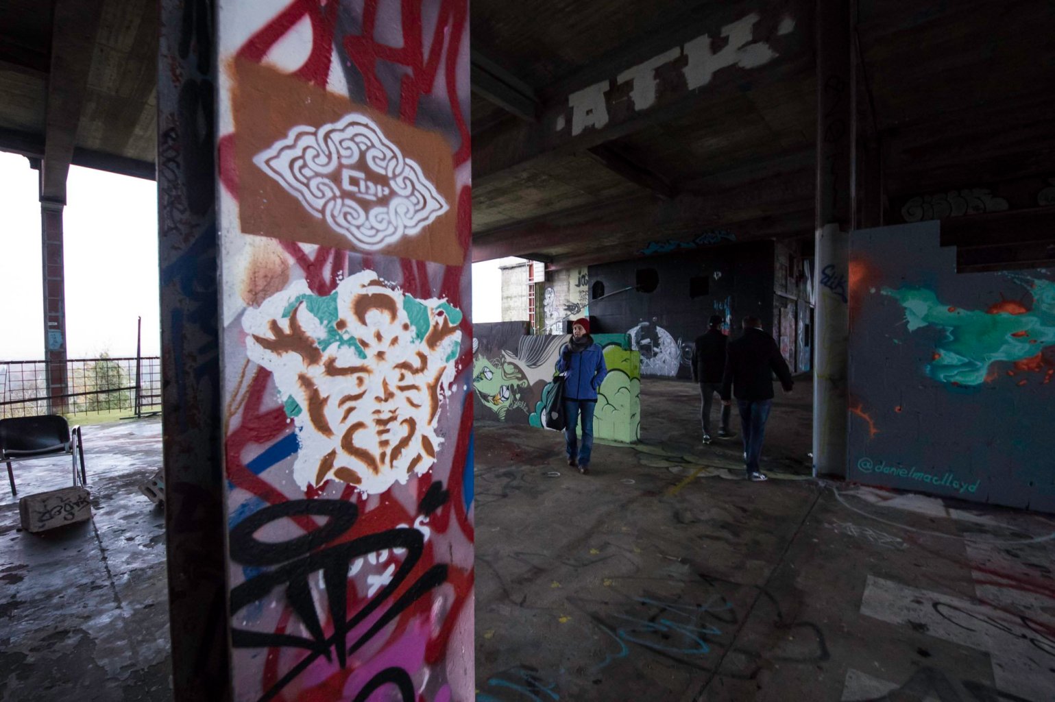 a person with graffiti on the side of a building