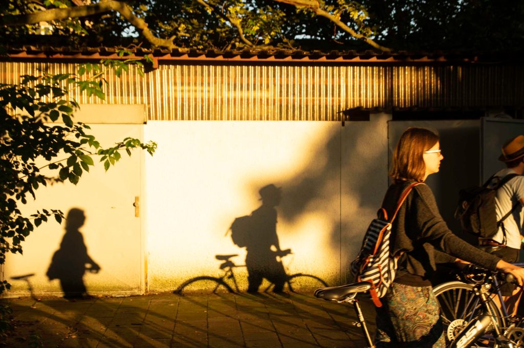 a person riding on the back of a bicycle