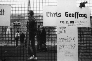 Chris_Gueffroy-300×197 a sign on the side of a building