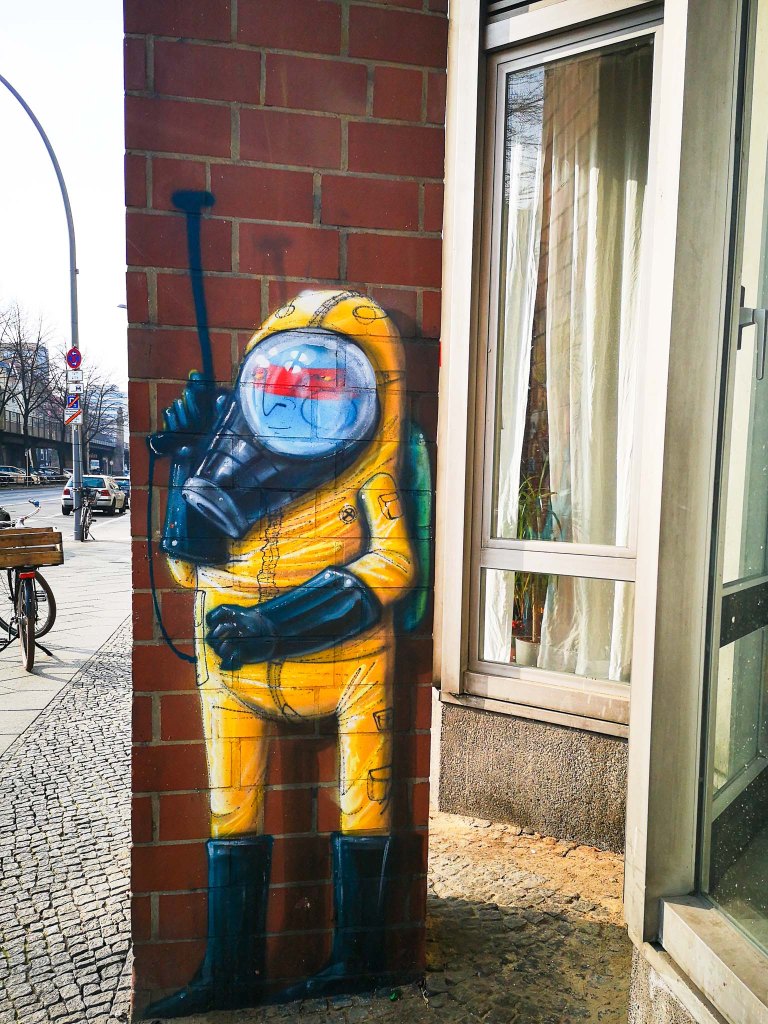 Blue Indian by Cranio in an enviromental protection suit in Schoeneberg's Buelowstrasse