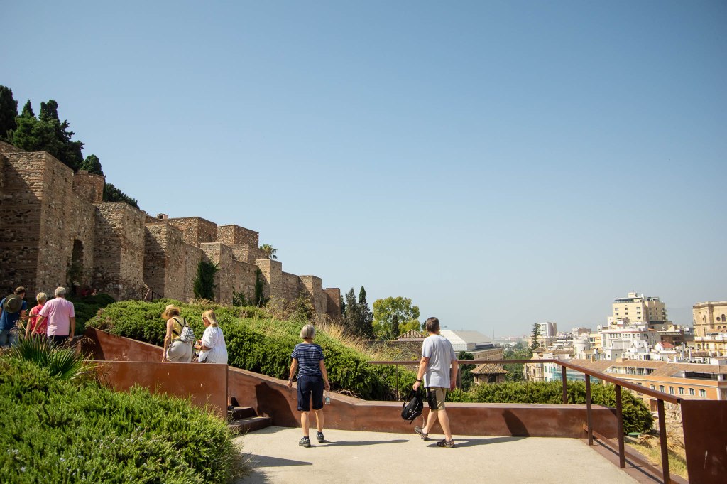 a group of people riding on top of a building