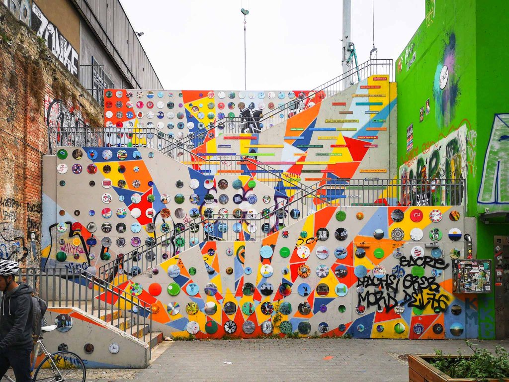Concrete staircase designed with 100s of painted circles. Each little artwork was designed by a different local from Neukölln
