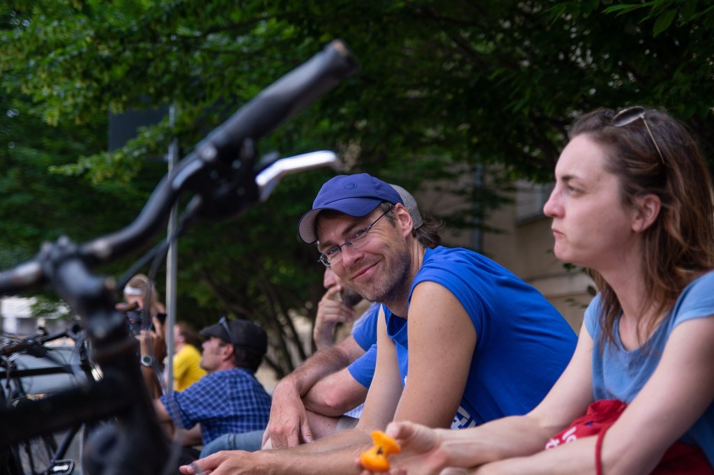a group of people sitting at a park