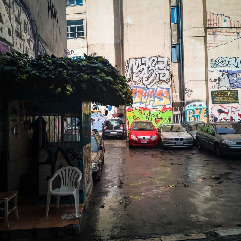 a city street lined with parked cars