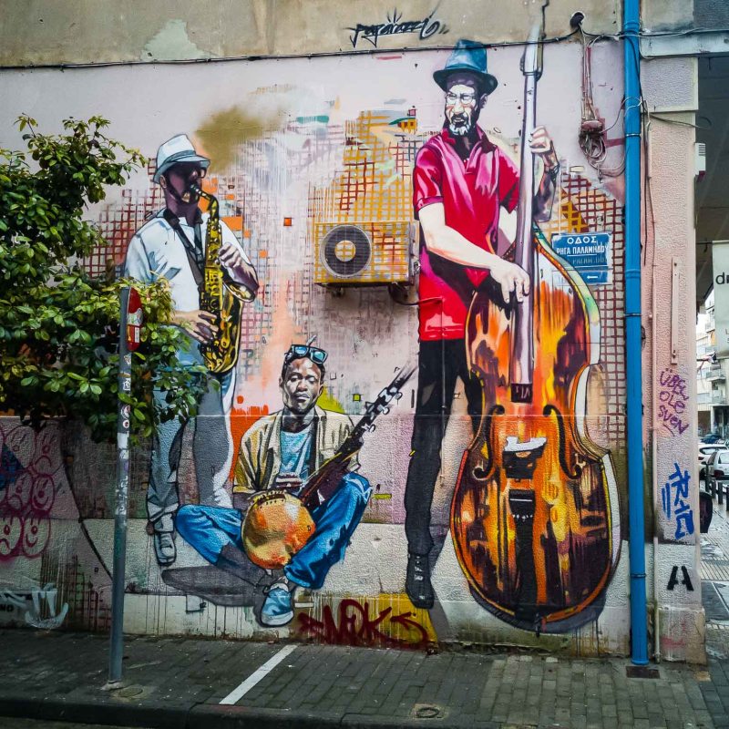 a person with graffiti on the side of a building