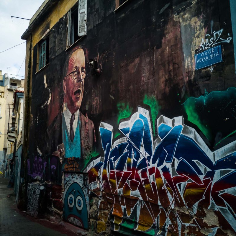 a person with graffiti on the side of a building