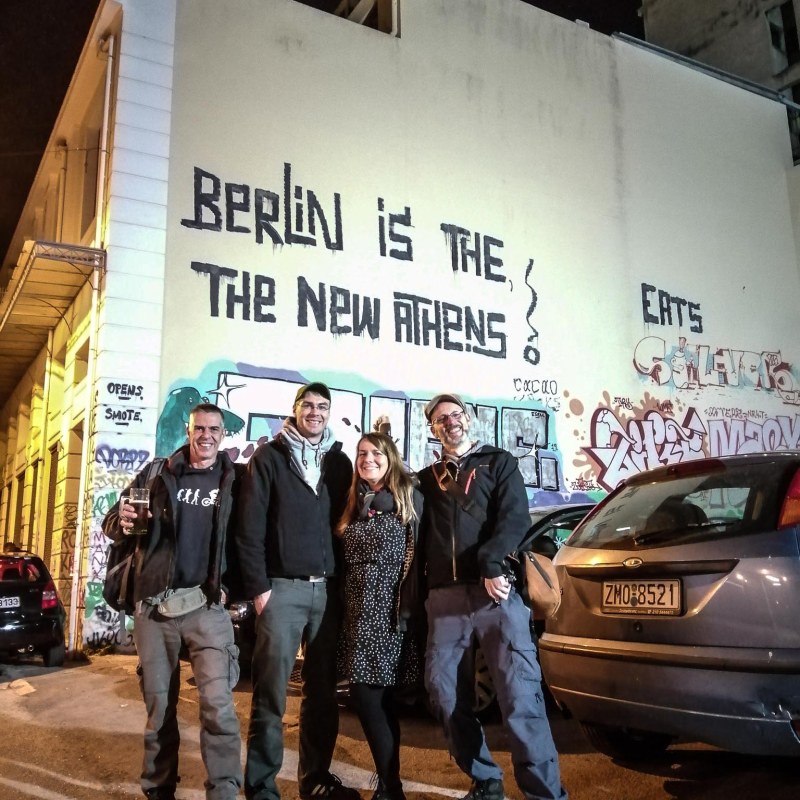 Leo Beenhakker et al. standing in front of a building