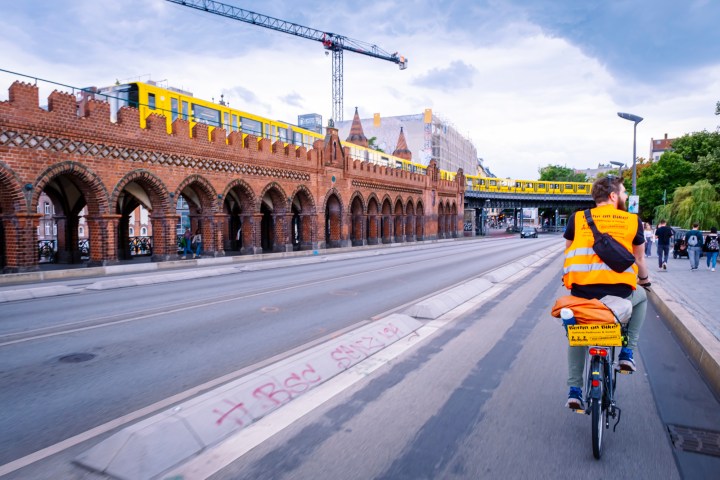 Berlin on Bike guide crossing the Oberbaumbrücke in Berlin