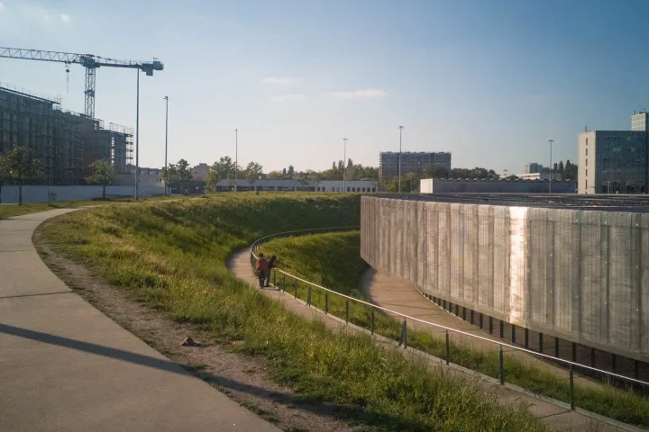 a long bridge over a river in a city