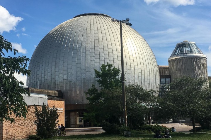 a large stone statue in front of Lowell Observatory