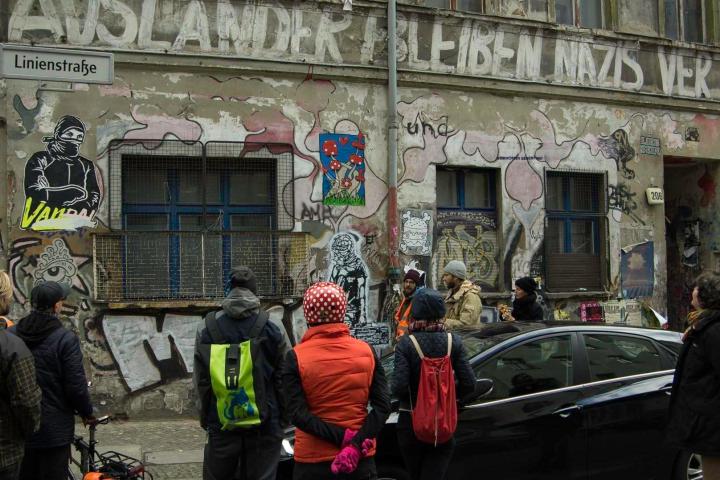 a group of people standing in front of a building