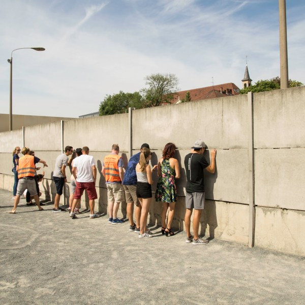 a group of people standing outside of a building