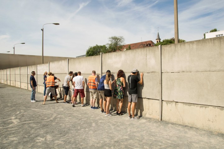 a group of people standing outside of a building