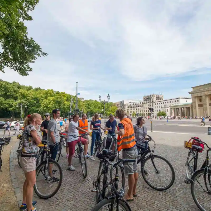 A group of caclist infront of the Brandenburg Gate