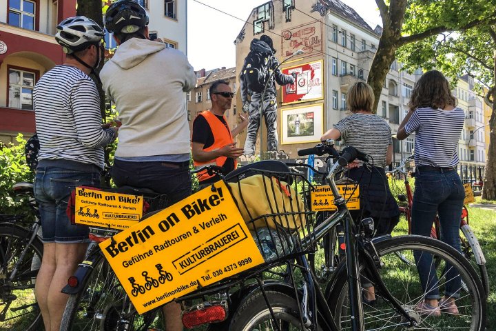 a person standing next to a bicycle