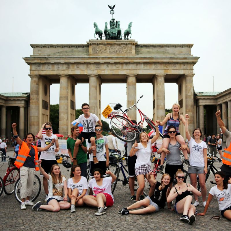 a group of people standing in front of a building