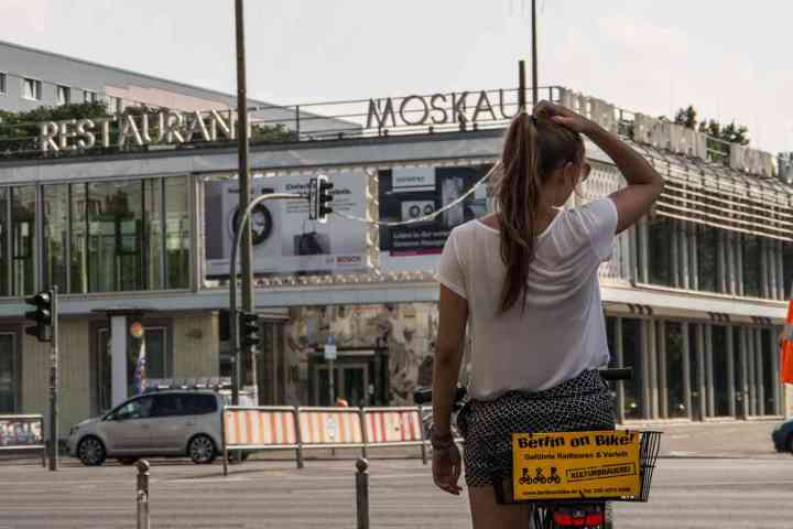 a person riding a skate board on a city street