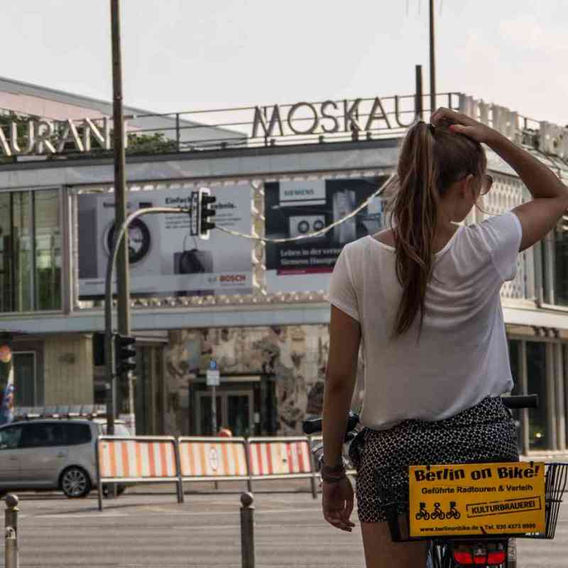 a person riding a skate board on a city street
