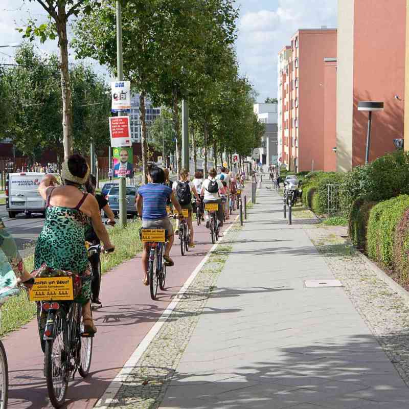 a group of people walking down the street