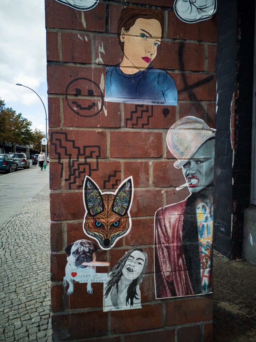 paste ups on a brick building