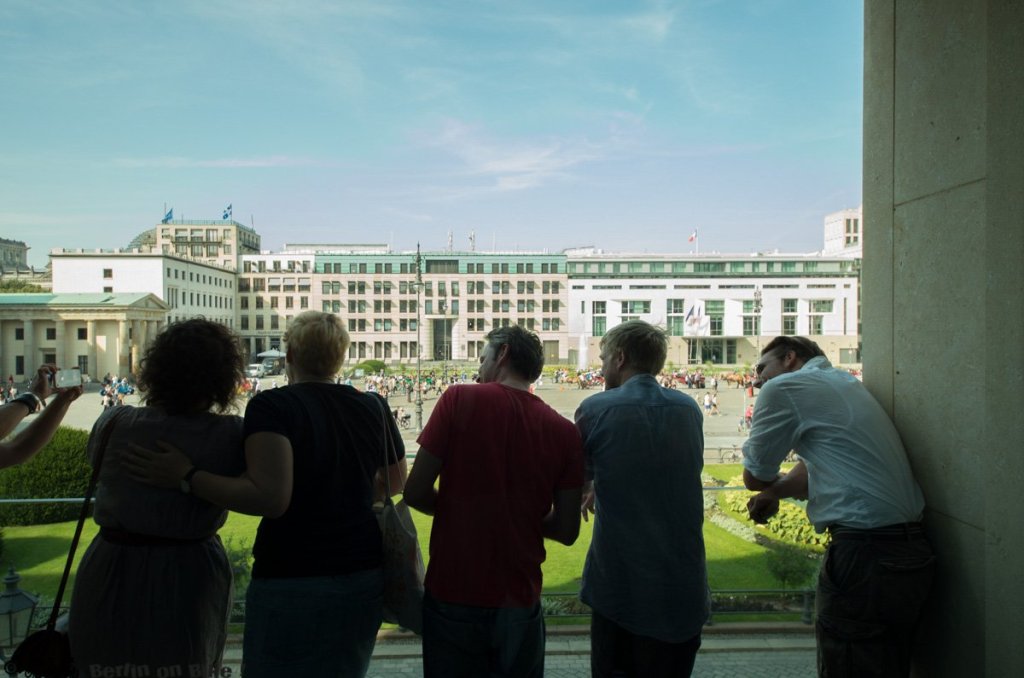 a group of people standing in front of a building