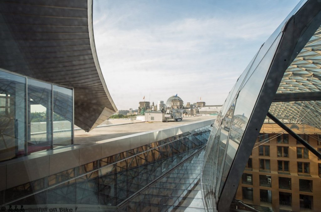 a bridge with a building in the background