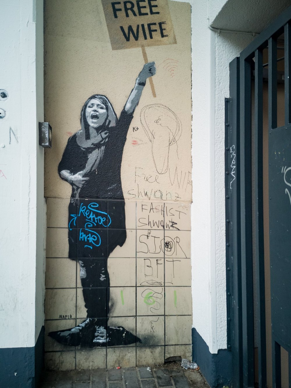 a person with graffiti on the side of a building