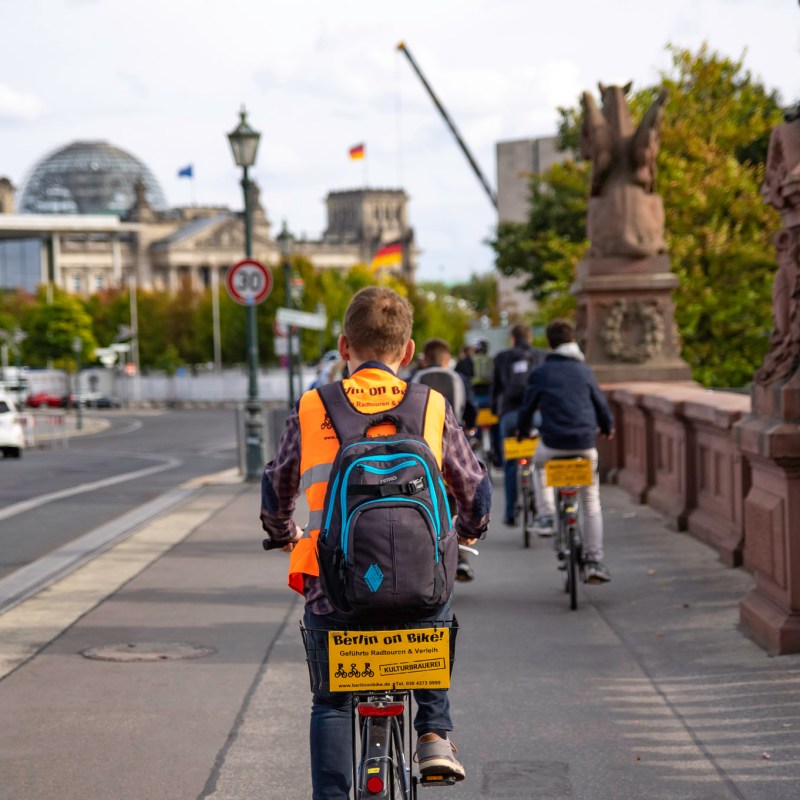 a person riding a skate board on a city street