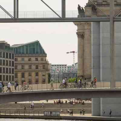 a group of people on a bridge