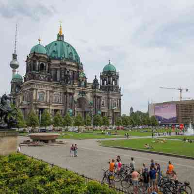 a group of people standing in front of a building