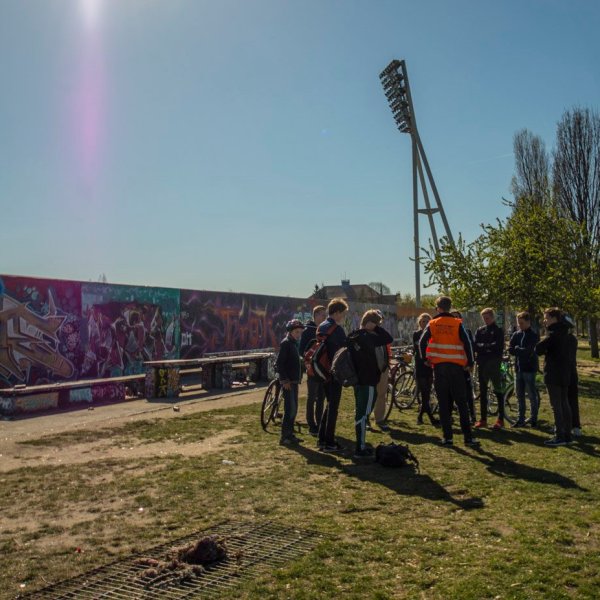 a group of people that are standing in the grass