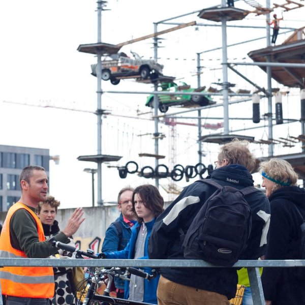 a group of people standing on a cart