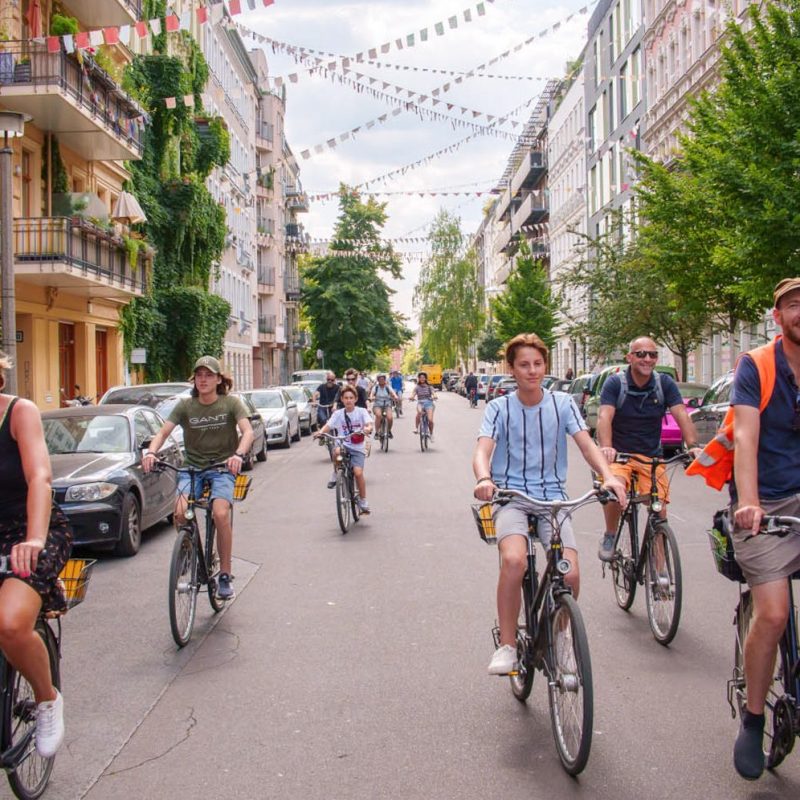 a person riding a bicycle on a city street