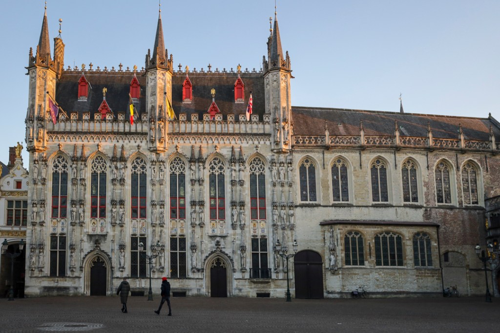 a church with a clock at the top of Bruges