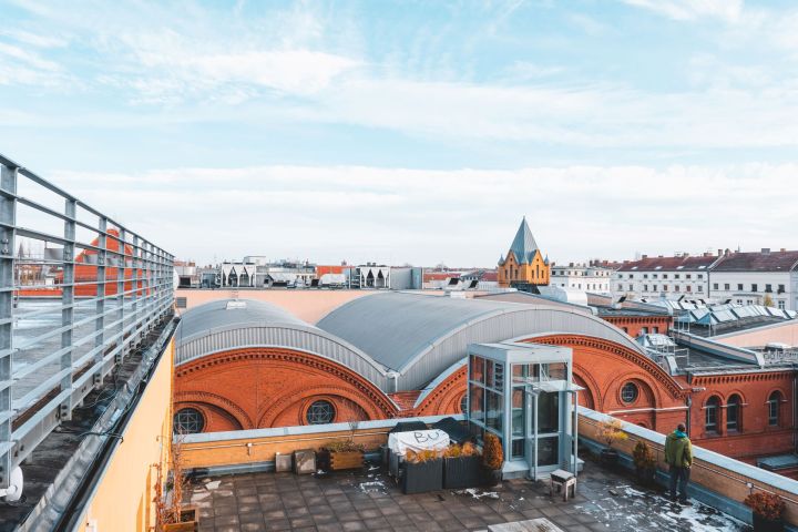 a train is parked on the side of a building