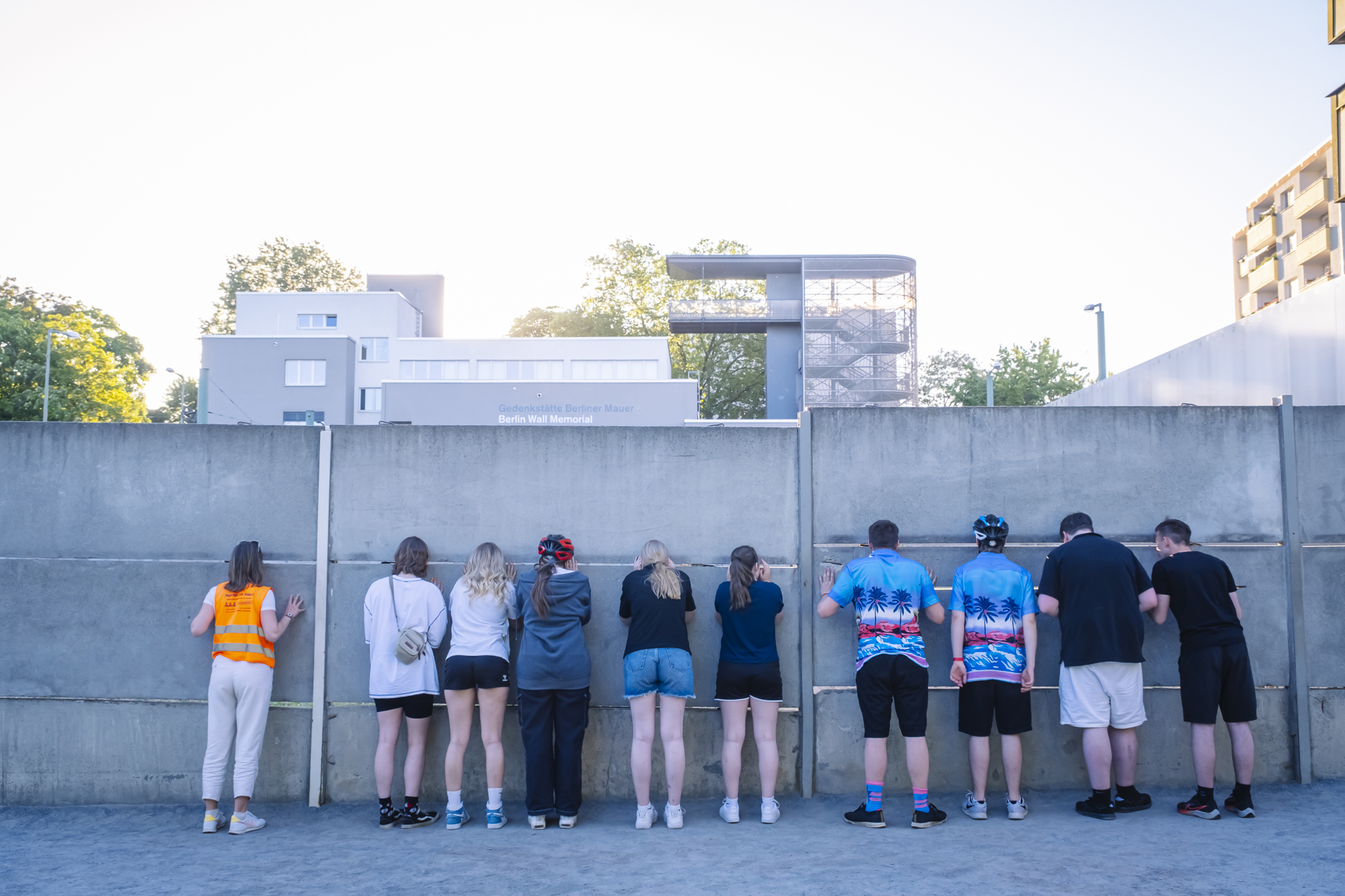 a group of people standing in front of a building