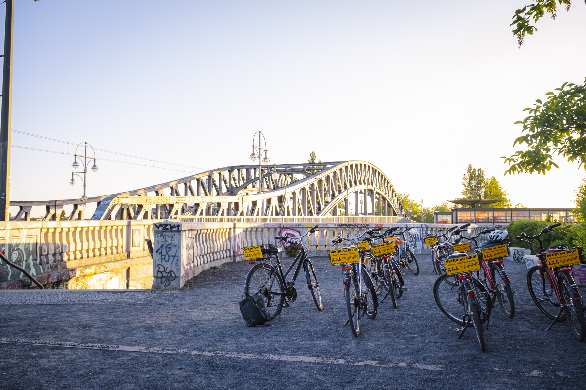 a group of people riding on the back of a bicycle