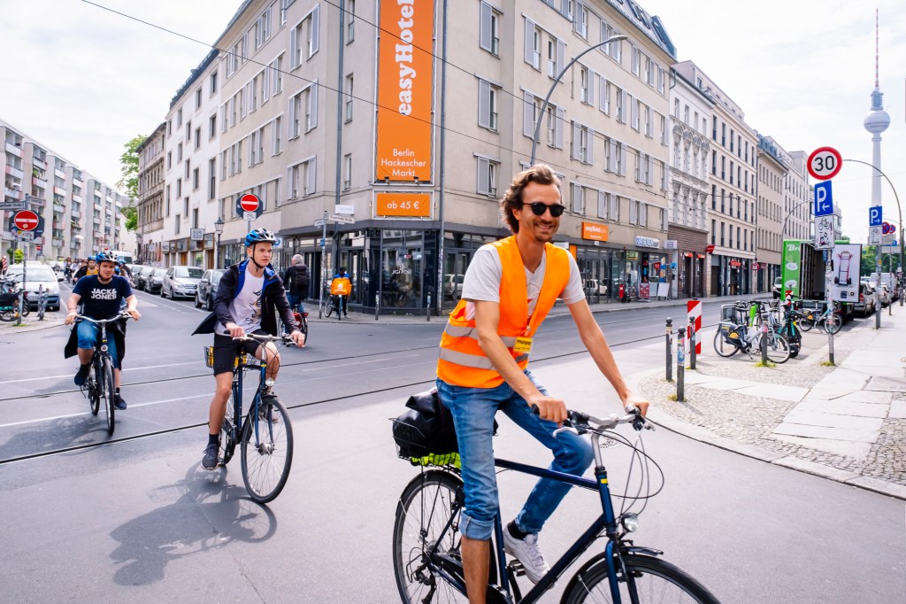 a person riding a bicycle on a city street